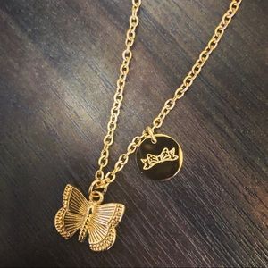 Gold butterfly necklace with bow disk